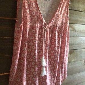 Sleeveless salmon and white colored top